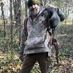 WeatherWool Advisor Josh Enyart in his Lynx Pattern WeatherWool Anorak with a possum playing possum (animal is unhurt)