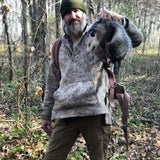 WeatherWool Advisor Josh Enyart in his Lynx Pattern WeatherWool Anorak with a possum playing possum (animal is unhurt)