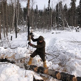 WeatherWool Advisor Jesse Manuta bucking logs by hand in 10F/-12C wearing WeatherWool in comfort