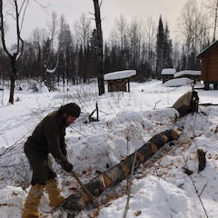 WeatherWool Advisor Jesse Manuta bucking logs by hand in 10F/-12C wearing WeatherWool in comfort