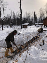 WeatherWool Advisor Jesse Manuta bucking logs by hand in 10F/-12C wearing WeatherWool in comfort