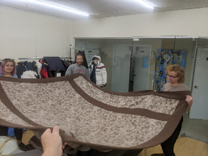 "Action Shot" of WeatherWool Queen Blanket at Better Team USA (tailor) shop
